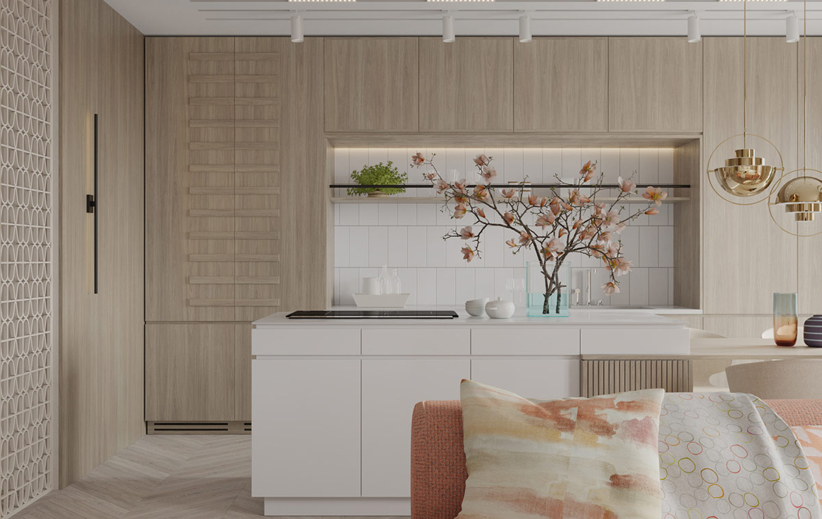 Phòng bếp thiết kế kiểu chữ I phía sau ghế sofa phòng khách, một không gian mở liên kết với nhau bởi sàn gỗ họa tiết xương cá và tủ gỗ cao kịch trần để tối ưu hóa không gian.