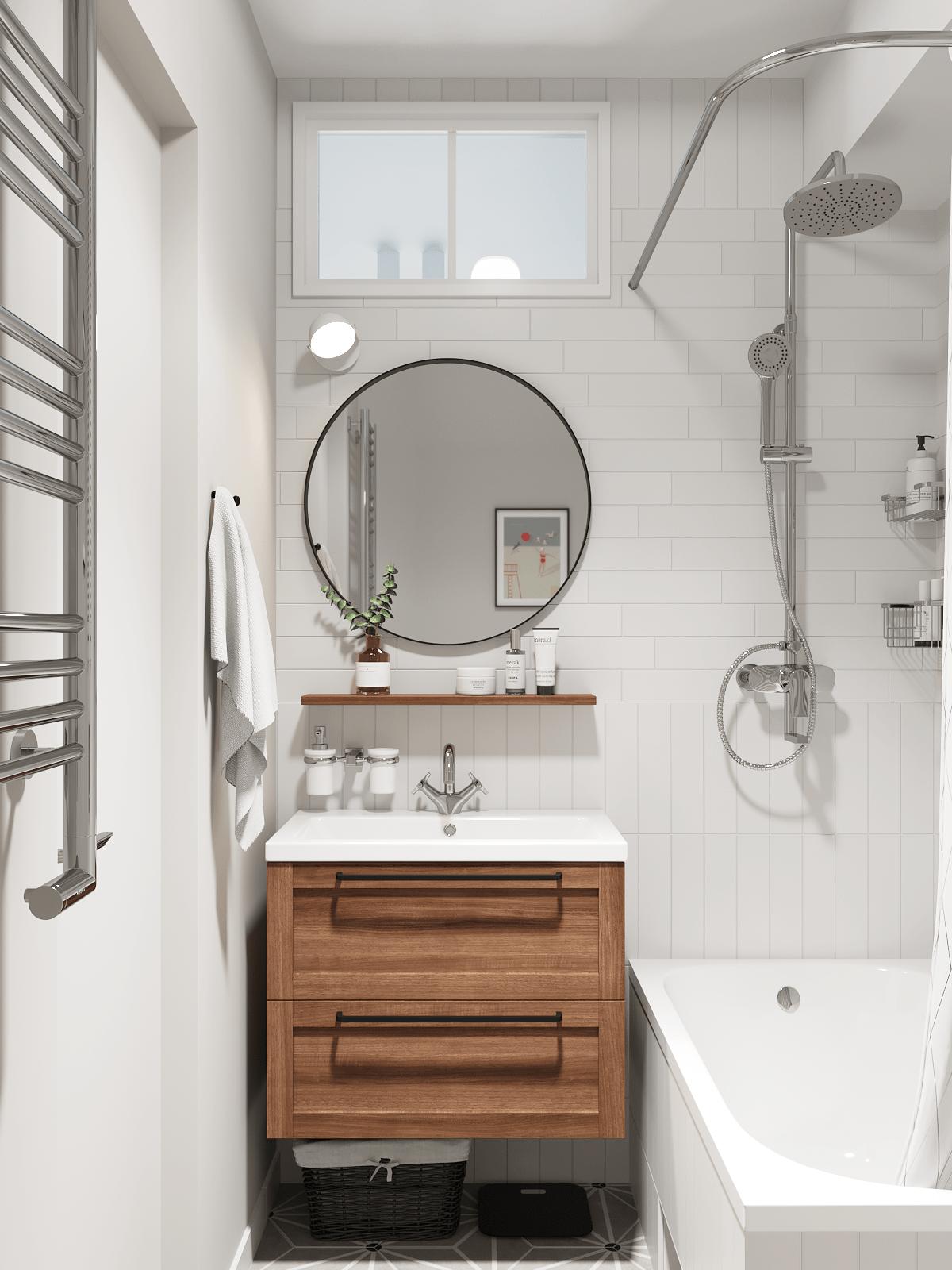 Phòng tắm với chiếc tủ gỗ kết hợp bồn rửa bằng sứ gắn tường tiện lợi, bên trên là kệ mở cùng tấm gương soi hình tròn phản chiếu ánh sáng cho không gian rộng hơn.