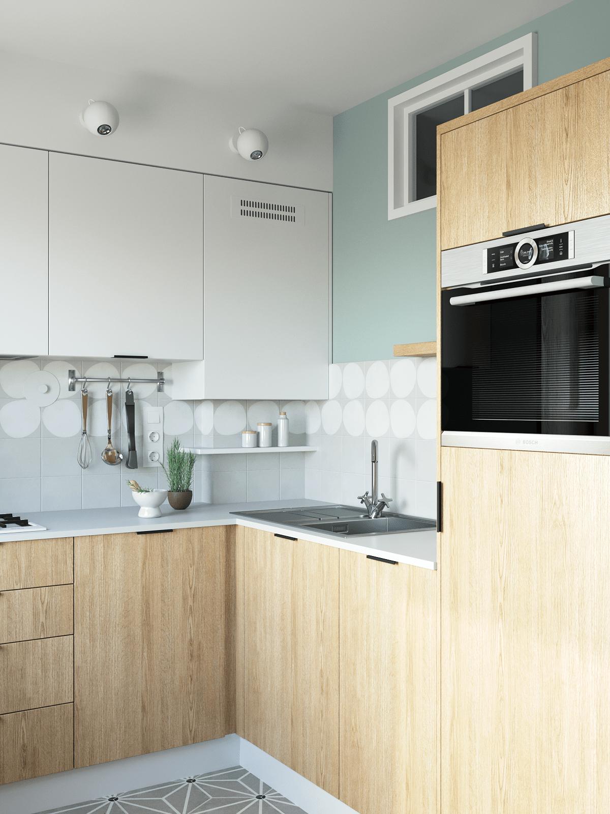 Phòng bếp tuy không rộng rãi nhưng đáp ứng đầy đủ tiện nghi, hệ tủ gỗ và tủ màu trắng tạo nên cái nhìn tương phản đẹp mắt. 