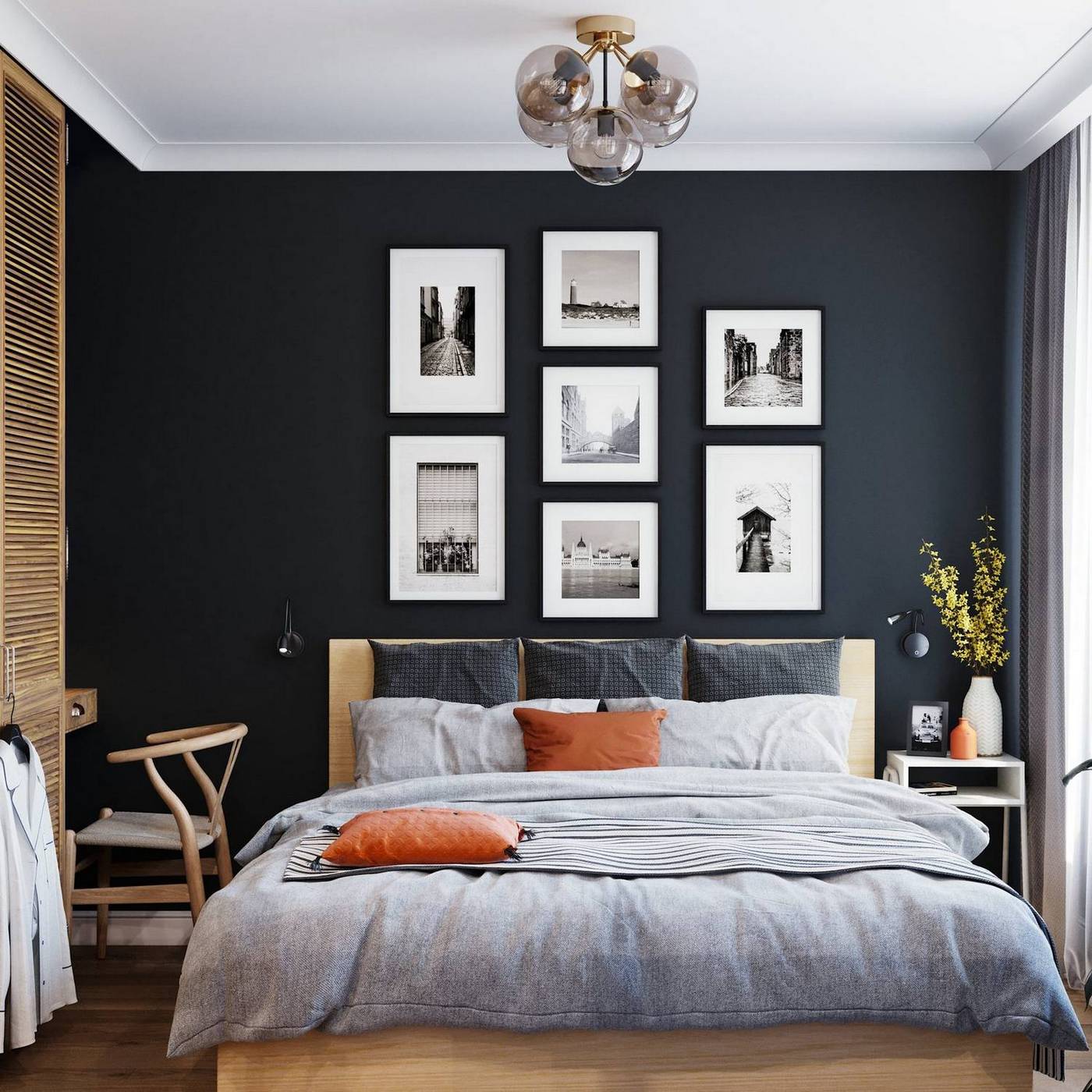 Bức tường sơn màu xám đen đậm, bên trên treo 7 bức tranh trắng đen với kích cỡ khác nhau tạo cho chúng ta sự liên kết về phong cách trang trí với khu vực lối ra vào căn hộ đã giới thiệu ở trên.