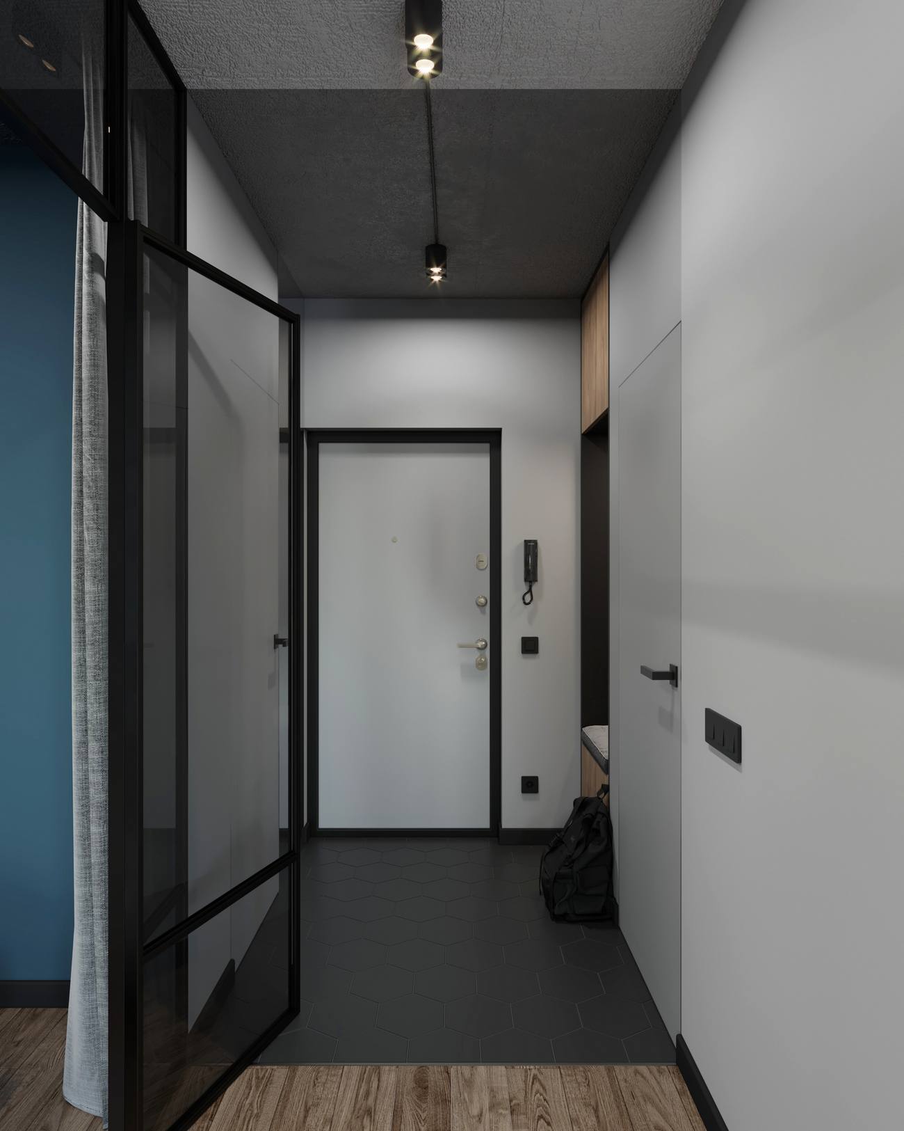 Lối vào căn hộ tạo sự bí ẩn ngay từ cái nhìn đầu tiên khi chỉ sử dụng gam màu tường xám nhạt, cửa viền khung màu đen và gạch lát sàn hình lục giác cũng đen tuyền như thế!
