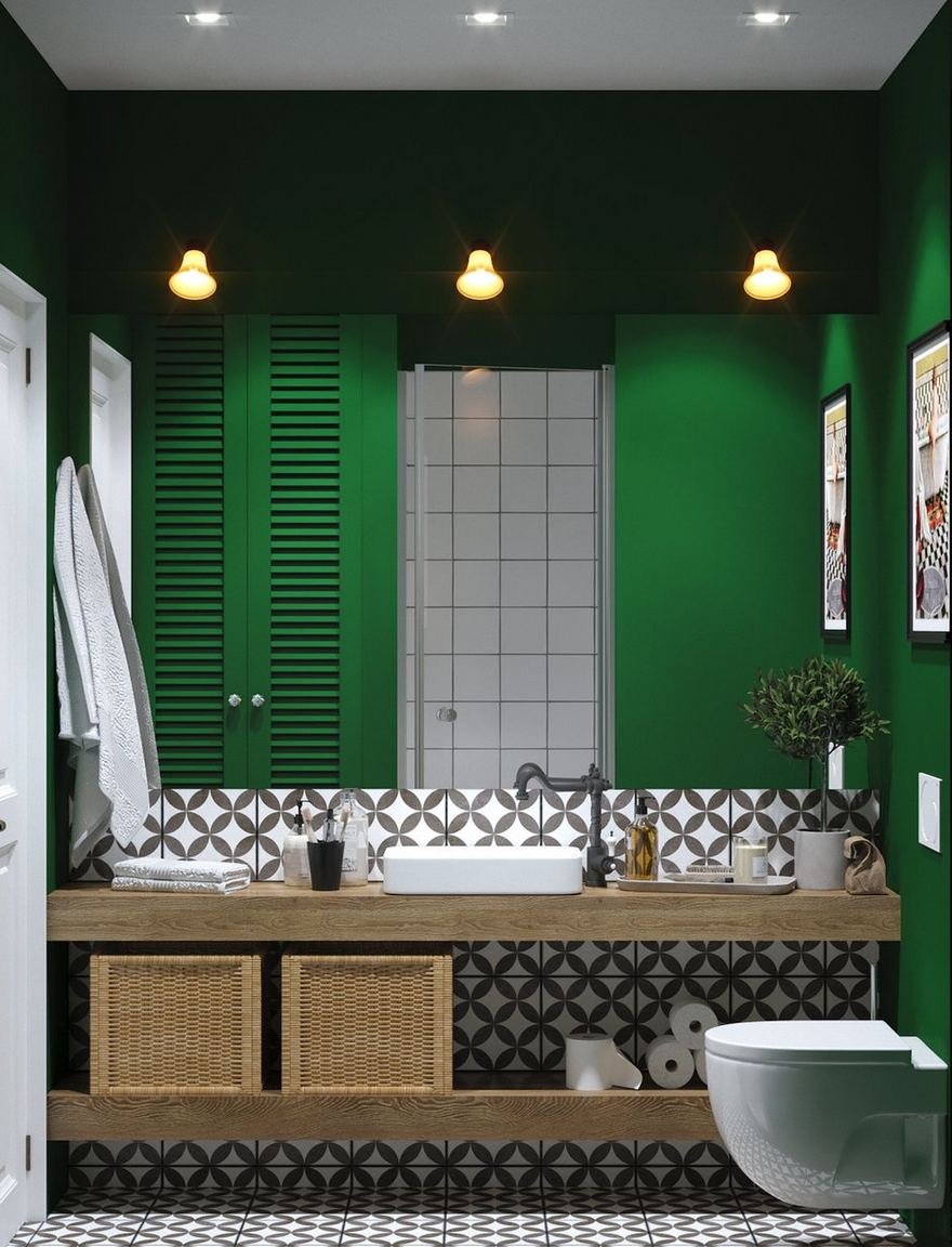Bước vào khu vực phòng tắm, bạn sẽ thấy cảm giác thân quen không chỉ đến từ bức tường và tủ sơn màu xanh lá cây đậm mà còn là gạch ốp lát hoa văn tương tự lối vào nhà tạo nên một sợi chỉ xuyên suốt căn hộ.
