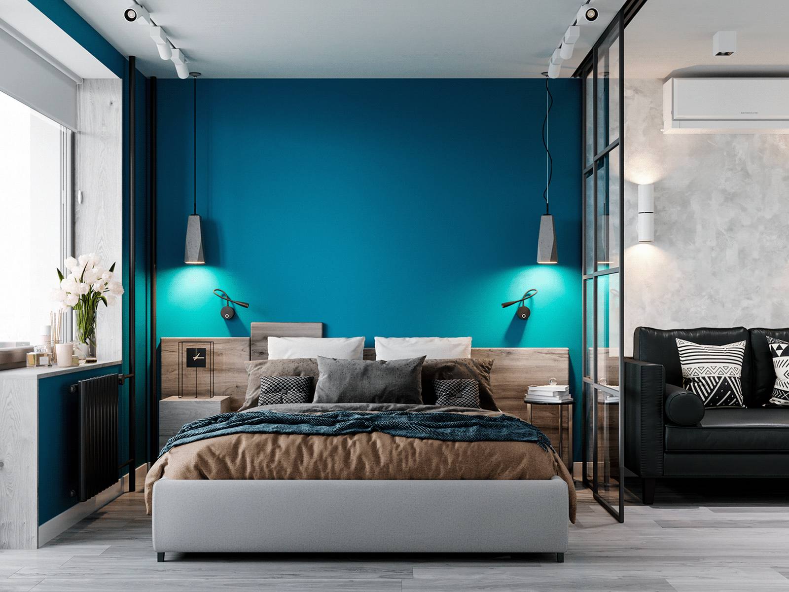 Phòng ngủ của bố mẹ với bức tường màu xanh lam đậm làm điểm nhấn nổi bật giữa không gian toàn sắc trắng và xám. Đầu giường bằng gỗ cho cảm giác vững chãi, hệ thống đèn gắn tường và đèn thả trần 'có đôi có cặp' tạo nên sự cân đối hài hòa.