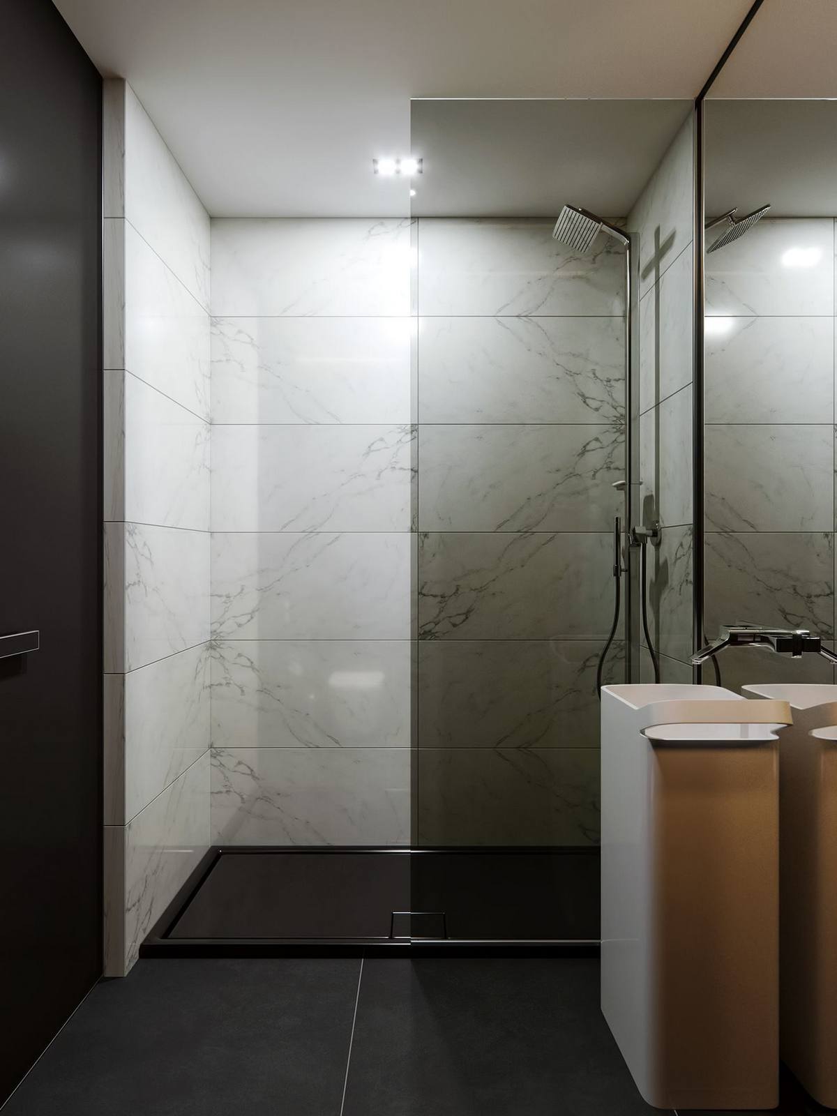 Mặc dù cũng sử dụng vật liệu đá hoa cương để trang trí nhưng tại phòng tắm của căn hộ có sự thay đổi để tạo khác biệt so với phòng khách, đó chính là sàn nhà lát đá màu đen còn đá granite trắng sử dụng để ốp tường cho vẻ đẹp tương phản ấn tượng.