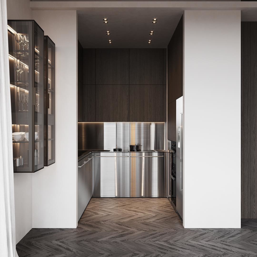 Và cuối cùng là ý tưởng tận dụng hốc tường vừa đủ rộng để thiết kế phòng bếp. Dự án do Artem Babayants thực hiện với trần nhà ốp đèn theo 2 hàng dọc, sàn họa tiết zigzag và hệ tủ bếp dưới kết hợp backsplash bằng inox cực chất.