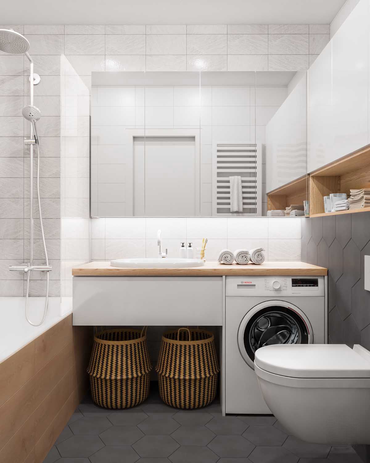 Khu vực bên dưới tủ vanity trong phòng tắm cũng là vị trí tuyệt vời để bạn có thể đặt một chiếc máy giặt cửa trước mà không tốn quá nhiều diện tích sàn. Bên cạnh nó có thể bổ sung vài chiếc giỏ phân loại đồ đạc để giặt giũ.