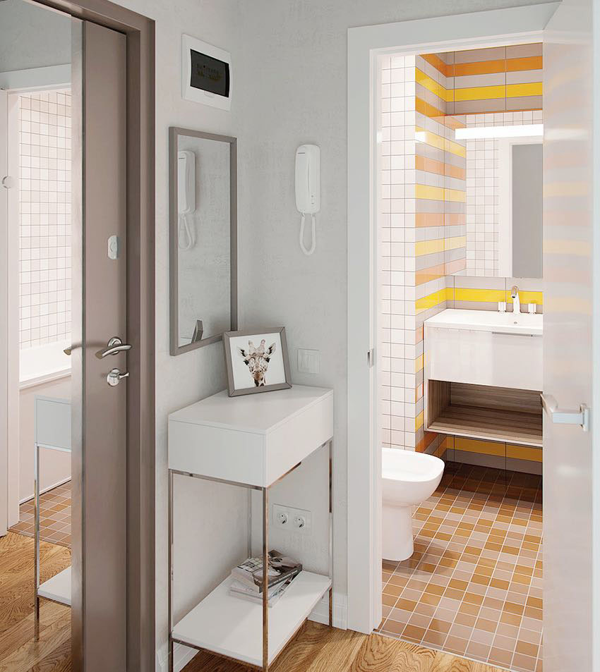 Phòng tắm và nhà vệ sinh tuy có diện tích 'khiêm tốn' nhưng lại cực kỳ nổi bật nhờ cách lựa chọn gạch ốp tường và lát sàn tươi sáng. Gương soi cũng góp phần nhân đôi diện tích cho không gian.